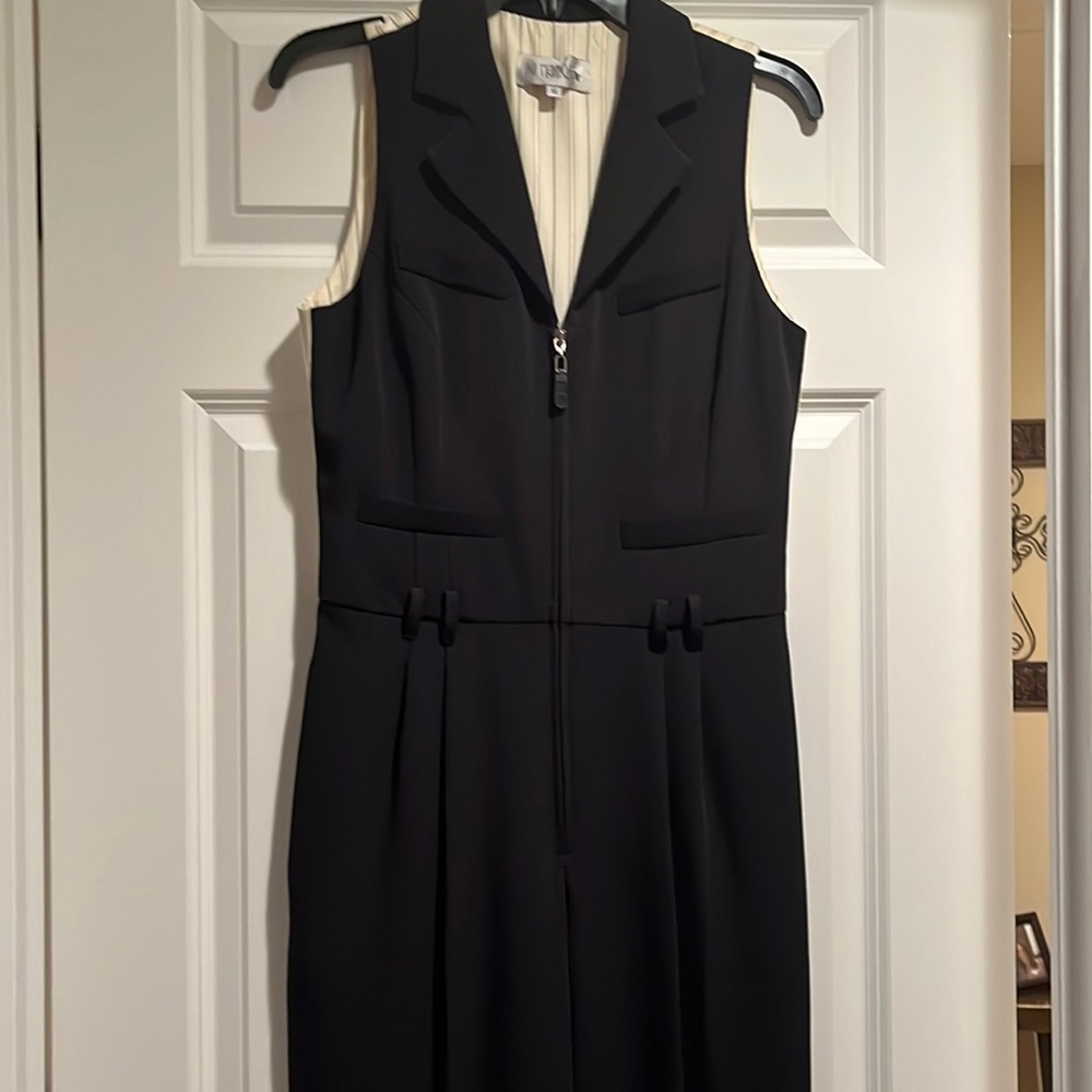 In Transit black pantsuit.  Front zipper.